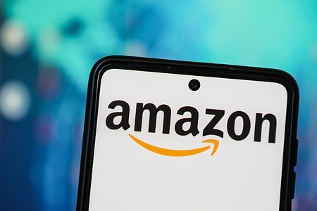 In this photo illustration, the Amazon logo is seen displayed on a smartphone screen.
