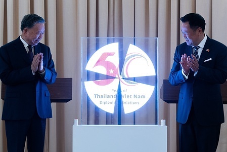 To Lam (L), the President of Vietnam and General Secretary of the Communist Party of Vietnam, and Anutin Charnvirakul (R), the Prime Minister of Thailand, seen standing next to a logo to celebrate the 50th anniversary of the two countries' diplomatic relations at Government House. Vietnamese General Secretary and President To Lam held high-level talks with Thai Prime Minister Anutin Charnvirakul in Bangkok ahead of the 50th anniversary of diplomatic relations between the two countries. The leaders launched a commemorative anniversary logo and signed a 2026–2031 action programme aimed at strengthening economic, technological, and defense cooperation under their Comprehensive Strategic Partnership.