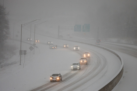 Traffic along the snow-covered I-69 during the snowfall in Bloomington.