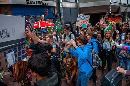 Protesters are seen jumping while shouting slogans in support of mother earth during the demonstration. Students and young people coming from all parts of the country gathered in the Dutch city of Arnhem to call for action on the demands of Indigenous, Black, and other marginalized communities to reappropriate their lands. The climate young organization #FridaysForFuture organized this march to keep demanding better climate policy and to stop the destruction of the lands of MAPA (Most Affected Peoples and Areas).