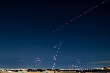 An Israeli Air defense system intercepts a ballistic missile barrage launched from Iran to central Israel during the missile attack.