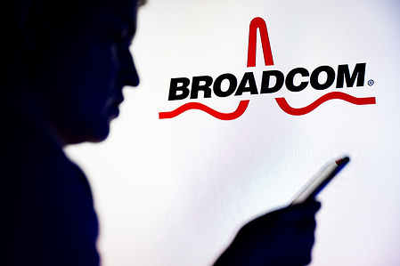 In this photo illustration, a Broadcom logo is seen displayed on TV.