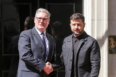 Prime Minister Sir Keir Starmer (L) and Ukrainian President Volodymyr Zelensky (R) shake hands at 10 Downing Street in Westminster ahead of the NATO Summit taking place over the next two days in the Netherlands.