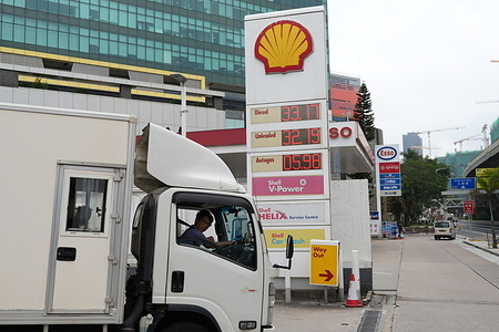 The gas price seen displayed at a gas station and all three types of gas are more than 30 dollars per litter.at Kowloon Bay. The gas price has increased amid the war in Iran and other countries in the Middle East area. The latest gas price at gas stations is more than 30 dollars per litter and most likely will be increased if the war continues. Many drivers are complaining and some of the drivers are considering switching to electric vehicles due to the high gas cost.