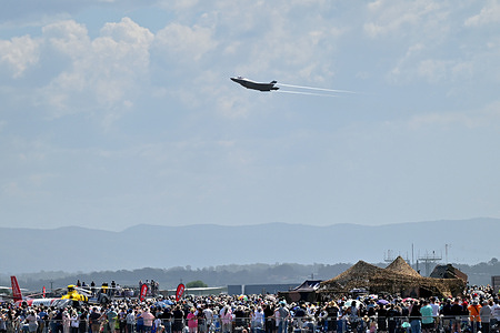 A general view as members of the public watch a Lockheed Martin F-35A Lightning II performs during the Royal Australian Air Force (RAAF) Richmond Airshow 2025 at the RAAF Airbase. The RAAF Richmond Airshow on 27 and 28 September 2025 commemorates 100 years of RAAF Base Richmond. The airshow showcases Australian Defence Force aircraft, military capabilities and Defence personnel.