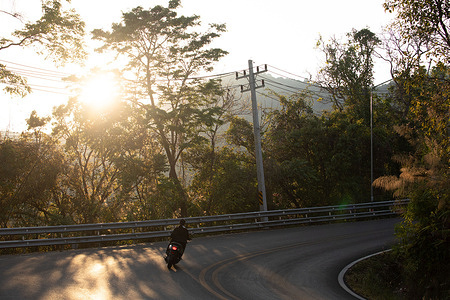 A motorcycle rides past on Doi Suthep Mountain during the burning season. Air pollution is choking the upper northern provinces, including Chiang Mai, as PM2.5 levels exceed safety thresholds during peak burning season. Thick smoke from local forest fires, farmers burning crop stubble, and even more from neighboring countries (Myanmar and Laos) has blanketed the popular tourist destination, reducing visibility.
Recent days have seen sharp rises in hotspots (up to 158 detected in Chiang Mai province), pushing AQI into the unhealthy range. Authorities are responding with burn bans, monitoring, and enforcement, including rewards for reporting illegal fire starters, but the problem, driven mainly by human-initiated biomass burning, continues to affect residents and visitors.