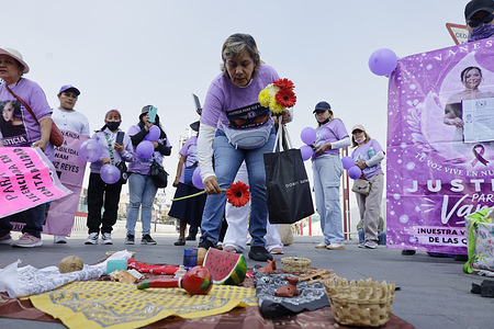 Teresa Gutiérrez, mother of Andrea and Alejandra, victims of femicide, places flowers on an altar beneath the statue of the Chimalli Warrior, who marched to the municipal seat of Chimalhuacán in the State of Mexico to demand justice and punishment for the perpetrators, on the occasion of International Women's Day in Mexico. According to the United Nations, International Women's Day is commemorated in many countries around the world. When women from all continents, often separated by national borders and ethnic, linguistic, cultural, economic and political differences, come together on this day, they can contemplate a tradition of no less than ninety years of struggle for equality, justice, peace and development.