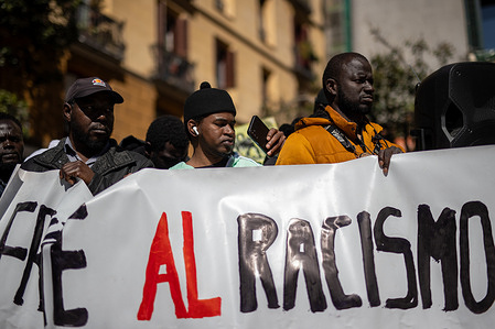 Protesters hold a banner during a demonstration. Anti-racist and migrant groups in Madrid gathered in Lavapiés Square to protest police racism following the arrest on Thursday in Madrid of Serigne Mbayé, a former Podemos member of the Madrid Assembly.