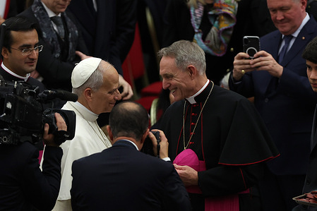 Father Georg Ganswein greets Pope Leo XIV during the event. Maestro Riccardo Muti's concert with the Luigi Cherubini Youth Orchestra and the "Guido Chigi Saracini" Siena Cathedral Choir was held at the Paul VI Hall. On this occasion, Muti received the prestigious "Ratzinger Prize," established in 2011 and awarded annually, with the Pope's approval, to eminent figures in Christian culture and art.