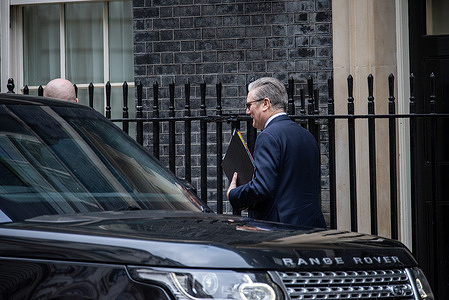 Keir Starmer walks to his car to go to the Prime Minister's Questions at the House of Common in the Parliament. Prime Minister of the United Kingdom, Keir Starmer leaves Downing Street in London to face with the Prime Minister's Questions at the House of Commons in the Parliament. Prime Minister's Questions is a weekly session where the Members of the Parliament can directly question the Prime Minister about the government policies and event.