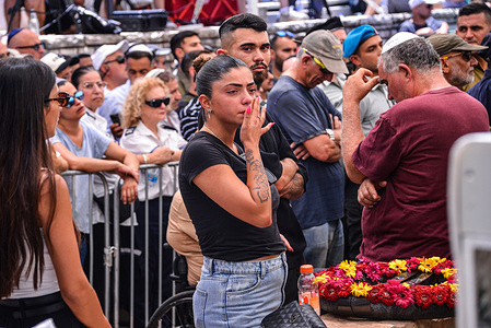 Mourners weep at the funeral of Israel Defense Force (IDF) soldier Omer Smadga, who died in the Gaza Strip during the Israel-Hamas war. The funeral of Israel Defense Force (IDF) soldier Omer Smadga, who died in Gaza Strip during the Israel-Hamas war.