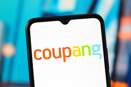 In this photo illustration, the Coupang logo is seen displayed on a smartphone screen.
