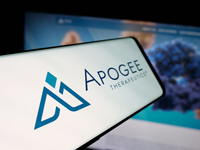 In this photo illustration, a smartphone with the logo of US biotech company Apogee Therapeutics Inc. is seen on screen in front of website.