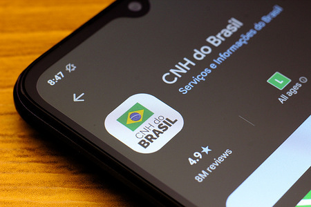 In this photo illustration, the CNH do Brasil logo is seen displayed on a smartphone screen.