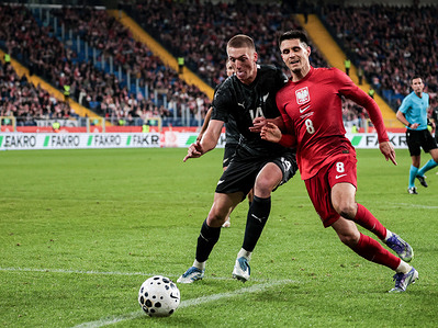 Polish football player Bartosz Kapustka and Finn Surman of New Zealand seen in action during the friendly match between Poland and New Zealand at Silesia Stadium. Final score; Poland wins 1:0.