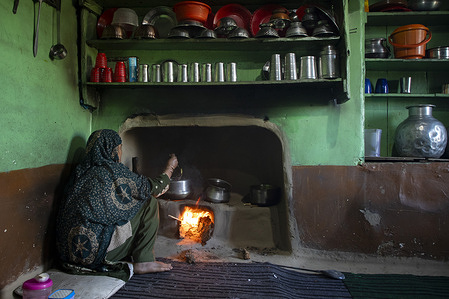 A woman prepares food on a traditional mud stove using firewood amid a shortage of liquefied petroleum gas (LPG) cylinders on the outskirts of Srinagar, Indian-administered Kashmir. India, one of the world’s largest importers of liquefied petroleum gas (LPG), is witnessing supply disruptions and rising concerns over cooking gas availability, alongside recent increases in LPG prices. Domestic cylinder rates have been revised upward amid volatility in global oil and gas markets, as escalating tensions and conflict involving the United States, Israel and Iran in the Middle East continue to disrupt key energy supply routes. The situation has been further compounded by delays in shipments passing through critical transit corridors such as the Strait of Hormuz, through which a significant share of global LPG supplies flows.
