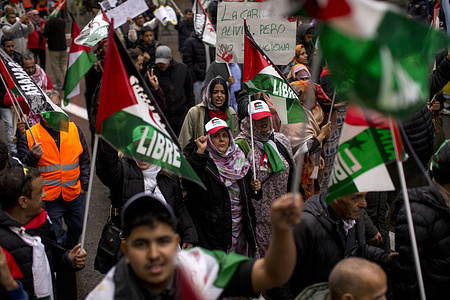 Members of the Sahrawi community in Madrid, waving flags, chant slogans during a demonstration through the streets of Madrid under the slogan "50 years of resistance of the Sahrawi people", demanding the self-determination of the Sahrawi people.