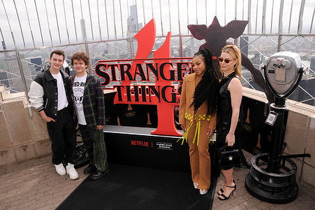 Noah Schnapp, Gaten Matarazzo, Priah Ferguson and Cara Buono visit the Empire State Building to celebrate 'Stranger Things' season 4 in New York City.