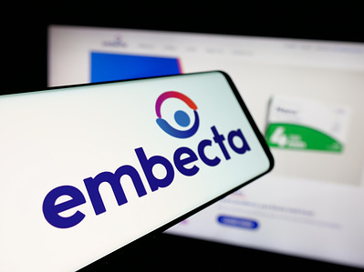 In this photo illustration, a smartphone with the logo of US medical device company Embecta Corp. is seen on screen in front of website.