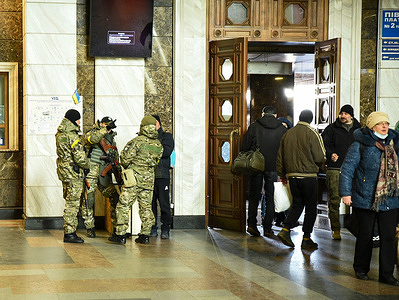 Ukrainian army and territorial defense patrol monitor the central railway station in Kyiv. Over 2 million Ukrainians have crossed the borders in Poland, Romania and Moldova as refugees due to Russian invasion.