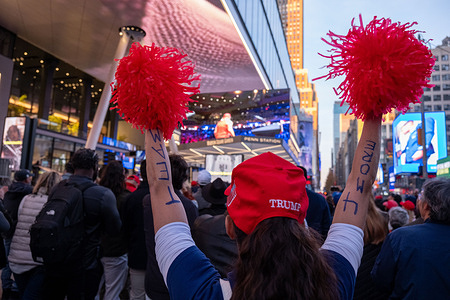 A woman cheers with red pom poms as Hulk Hogan approaches the stage on screen. Former President Donald Trump held a rally for his supporters at New York’s Madison Square Garden just 7 days before the elections. An estimated twenty thousand people waited inside the Garden for Trump to speak while those that could not get in gathered outside along with those protesting Trump.