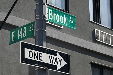 A street sign at the scene where a 31-year-old man was shot in the head and is currently listed in critical condition in Mott Haven, Bronx. Friday afternoon at approximately 2:32 PM in the area of East 148th Street and Brook Avenue a 31-year-old man was shot in the head in the Mott Haven section of the Bronx in New York City. No arrests have been made and the victim is in critical condition at this time.