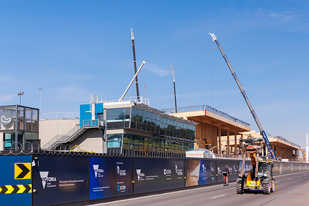 Construction is progressing on the $426 million Albert Park Pit Building redevelopment project in Melbourne, upgrading Formula 1 pit lane infrastructure and team garages ahead of the 2028 full-completion target. The 2027 Australian Grand Prix will utilize a combination of new, existing, and temporary facilities while site work continues, as four-day general admission ticket prices rise to $425 alongside new membership packages starting at $275.