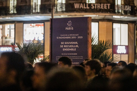 A banner that says "remember, reflect, together" seen at the Place de Republique during the ceremony. A ceremony to pay tribute to the victims of the 13th November 2015 terror attacks took place at the Place de République, marking a decade since the terrorist attacks. Jihadist gunmen and suicide bombers staged a series of coordinated attacks in and around the city on the night of November 13, 2015, killing 130 people, with the Islamic State group claiming responsibility.