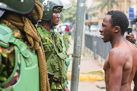 A Protester engages the police on their right to protest during the anti-government demonstration. The Youth-led, anti tax hike protests continue despite President William Ruto's announcement on 26 June that he would not pass the proposed finance bill and firing the Cabinet secretaries on July 11, 2024. The state-funded Kenya National Commission on Human Rights (KNCHR) has reported that at least 50 people have died and 413 were injured in relation to the protests.