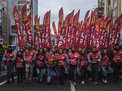 Turkish Communist Party members shout slogans during a May Day rally marking International Workers' Day. May1st Labor and Solidarity Day was celebrated with enthusiasm as the Confederation of Revolutionary Workers' Unions (DİSK) called for a meeting. Gathering at two points unions, civil society organizations (NGOs) and political parties came together in the Dock area, marching with banners and slogans.