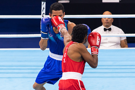 Khunatip Pidnuch (Blue) of Thailand and Elisio Raimundo Gaio (Red) of Timor-Leste seen in action during the Men's 63.5kg. Boxing finals in 33rd SEA Games at CU Sports Complex.