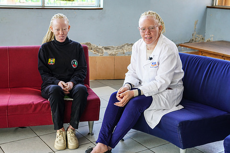 Leah Njeri (right) and Jane Njeri, campaigners for the rights of people living with albinism, seen conversing at the Nakuru National Library during the International Albinism Awareness Day. As the World commemorates International Albinism Awareness Day, acts of discrimination and stigmatization against members of this community is still prevalent.