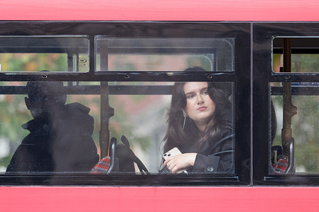 Passengers seen travelling on a double decker bus.