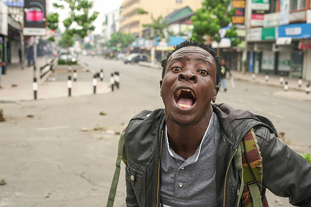 A protester chants slogans during the anti-government protest. A month ago, protests erupted across Kenya after President William Ruto proposed the Finance Bill. Despite Ruto withdrawing the legislation and dismissing almost all of his cabinet, protesters continue to demand his resignation and call for systemic changes to tackle corruption and improve governance.