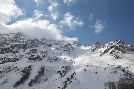 The French Alps, covered with snow, are seen from the Col du Lautaret.