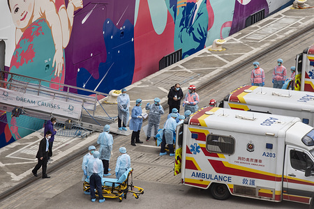 HONG KONG, CHINA - FEBRUARY 5, 2020:
Medical staff ready to treat passengers while the World Dream cruiser is docked at the Kai Tak Cruise Terminal, Hong Kong. Hong Kong authorities are keeping 3,600 passengers and crew members under quarantine on the cruise ship World Dream after three previous travelers were diagnosed with the novel coronavirus and escorted with ambulance.