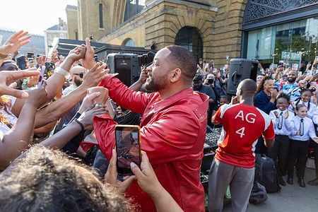 Will Smith greets fans as he makes a guest appearance with DJ Ag and performs some of his hit songs outside Kings Cross Station.