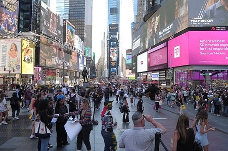 People are seen in Times Square, Manhattan, New York City.