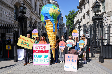 Members of the Mothers Rise Up group protest outside Downing Street in London with a giant melting planet-shaped ice cream cone, urging the government to reject the Rosebank oil field development and halt the expansion of oil and gas extraction in the North Sea. The demonstration coincides with the release of a report linking human-caused climate change to intensified heatwaves across Europe, according to the group.