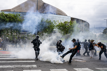 A protester attempts to kick the tear gas canister back at the police during the demonstration. Day 20 of the 2025 National Strike in Ecuador in discontent with the government of Daniel Noboa. The march was called as a peaceful demonstration by different social sectors. Thousands of people responded to the call and gathered at the Villaflora roundabout, south of Quito. The march was headed for El Arbolito Park; however, from the outset, the demonstration was dispersed by heavy repression and excessive use of tear gas. Despite this, hundreds of people managed to advance on foot along alternative routes until they reached the park, resisting constant repression. The use of tear gas did not stop at any point during the march.