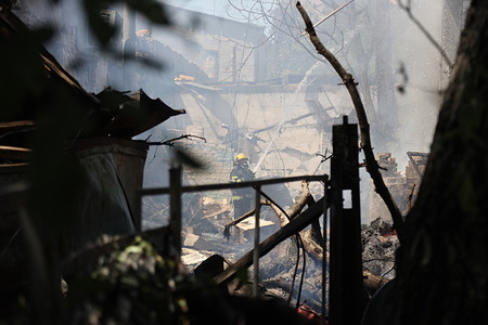 A firefighter extinguishes fire after drone attack in Moldovanka district of Odessa. Russia attacked Odessa with strike drones. The head of the Odessa Regional State Administration, Oleh Oleksandrovych Kiper said that nine people were injured as a result of the attack, and seven were hospitalized. In the area of the impact, windows of private houses were damaged and service station, cars damaged by debris.