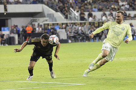 Los Angeles FC defender Aaron Long (33) heads the ball against Portland Timbers forward Vincent Janssen (14) during a MLS soccer game. Final scores; LAFC 1:1 Portland Timbers.