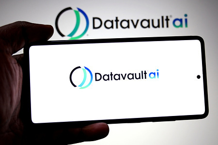 In this photo illustration, a Datavault AI logo is seen displayed on a smartphone and in the background.