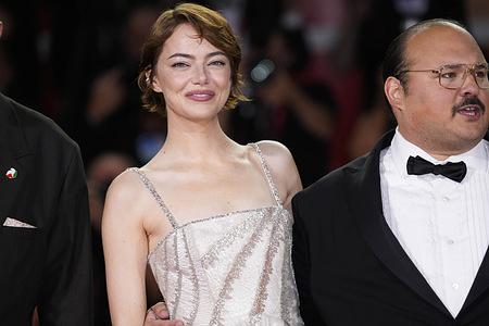 Emma Stone attends the "Bugonia" red carpet during the 82nd Venice International Film Festival.
