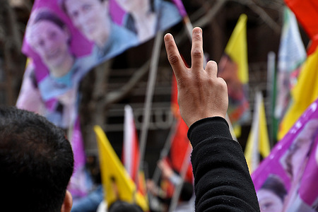 A Kurdish protester makes the V for victory sign during the demonstration. The Kurdish community of Marseille organized a demonstration to seek justice for the victims of the shooting incident near a Kurdish cultural center in Paris on December 23, 2022, which left six victims and three dead.