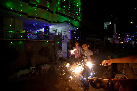 Indian people burn firecrackers on the occasion of Diwali, the Hindu festival of lights, in Prayagraj. The festival of Diwali is one of India's biggest holidays and it symbolizes the inner light that protects people from spiritual darkness or evil.