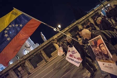 Protesters seen holding Venezuela flags and banner during the demonstration.
Thousand of people demonstrated in the center of Athens against USA and showing solidarity to Venezuela. The protest ended at the US Embassy.