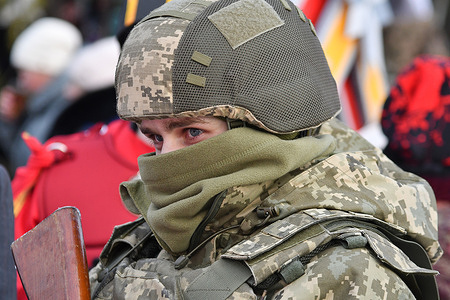 A participant in ukrainian army uniform seen during the "Christmas Birds" (Rizdviani Ptashky) "Vertepia" charity festival. The event gathers dozens of Nativity play groups (Vertep) from across the region to perform carols and raise funds for the Ukrainian Armed Forces during the winter holidays.