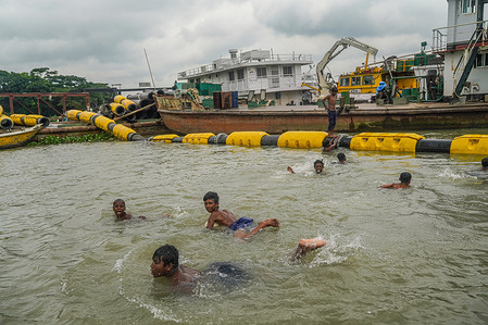 Children are seen playing at Shitalakshya river in Narayanganj.