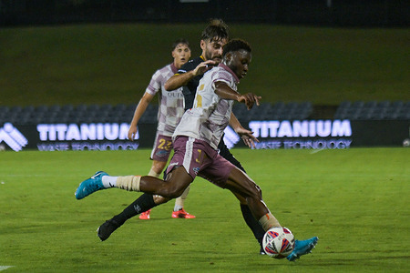 Hosine Bility (front) of Brisbane Roar and Ivan Vujica (back) of Macarthur FC seen in action during the Isuzu UTE A-League 2024-25 season round 6 match between Macarthur FC and Brisbane Roar FC held at the Campbelltown Sports Stadium. Final score Macarthur FC 4:4 Brisbane Roar FC.